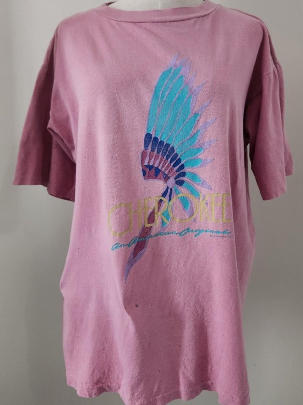 Vintage Cherokee tee with blue and purple feathered headdress graphic.